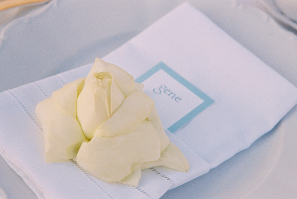 white and light blue napkin, flower and place card wedding photo by Yvette Roman Photography